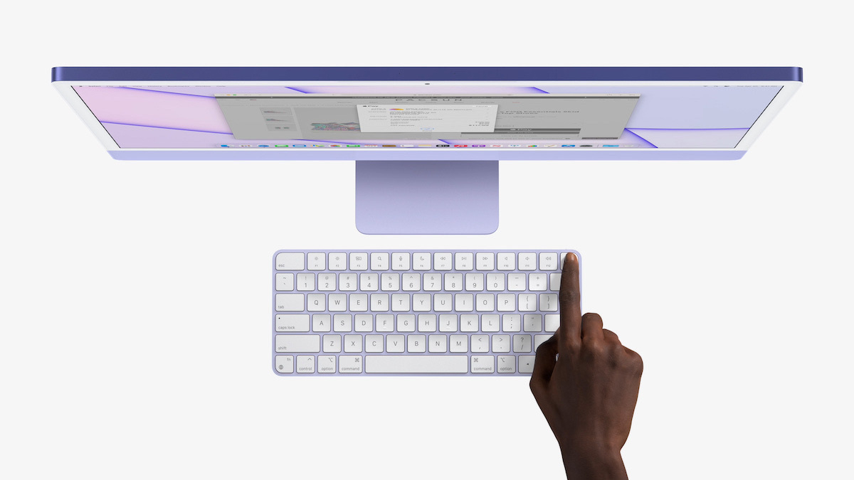 Purple iMac with purple Magic Keyboard with Touch ID sensor.